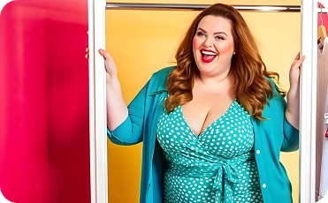 Confident plus-size woman symbolizing successful smart bidding and broad match keyword strategies used by BrandLoom to boost Ashley Stewart’s ROAS