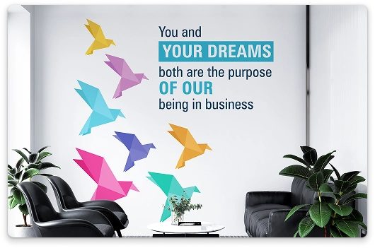 Office wall mural with colorful bird silhouettes and motivational quote designed by BrandLoom for Sriram Transport Finance