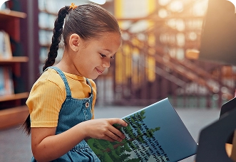 A woman reviewing website content on a laptop, symbolizing BrandLoom’s on-page SEO enhancements.