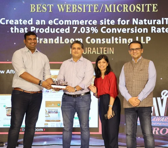 BrandLoom receiving the Best Website award at the e4m Maverick Awards for high-performing digital experience