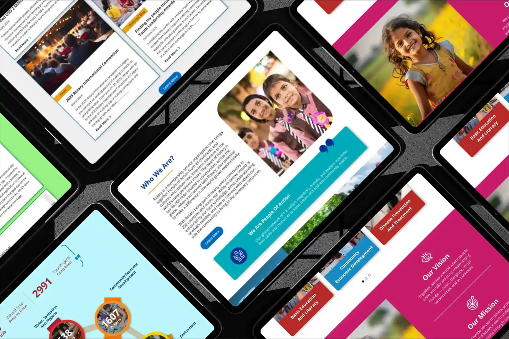 Landscape tablet screen displaying a modern web design on a concrete surface