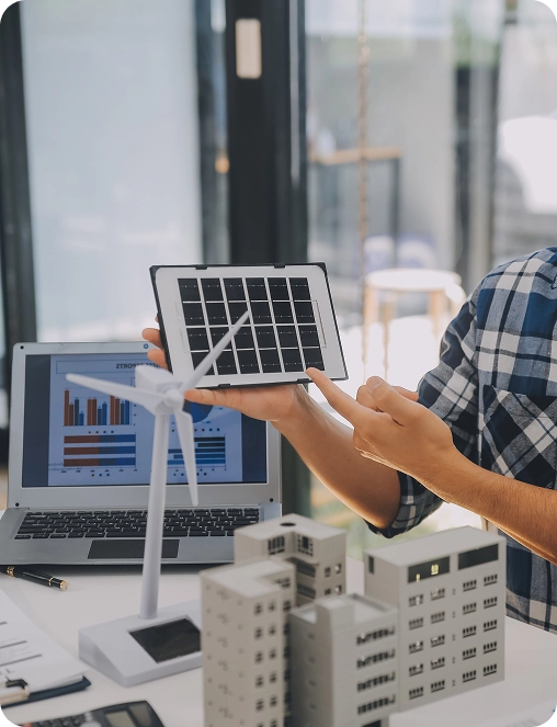brandloom-agni-solar-results-demonstration Person demonstrating solar and wind tech models, representing BrandLoom’s measurable impact on visibility and brand authority.